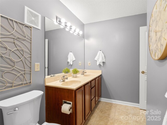 91 Morningside Ln, Hendersonville, NC 28792 - bathroom with double vanity, tile patterned flooring, and a textured ceiling