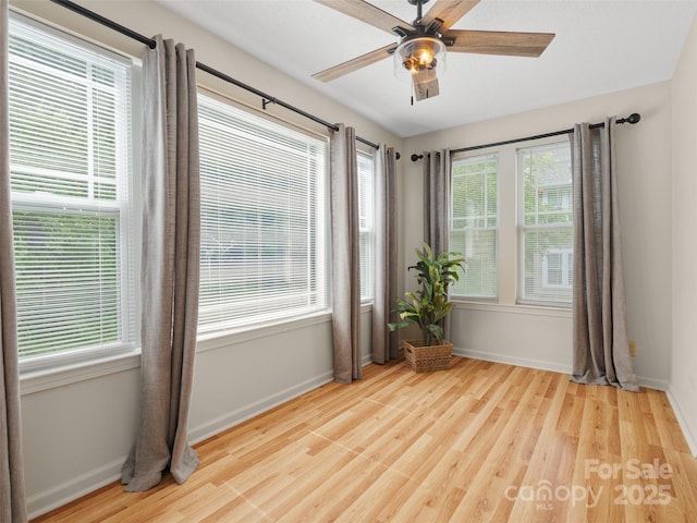 91 Morningside Ln, Hendersonville, NC 28792 - spare room featuring wood finished floors, ceiling fan, and healthy amount of natural light