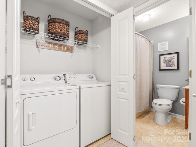 91 Morningside Ln, Hendersonville, NC 28792 - washroom with washer and dryer and light tile patterned floors