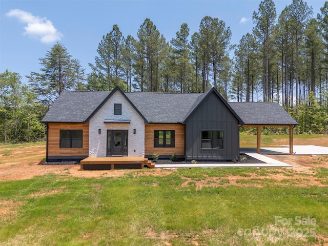 1872 Piney Mountain Church Rd, Bostic, NC 28018 - modern farmhouse with board and batten siding, a front lawn, and a shingled roof