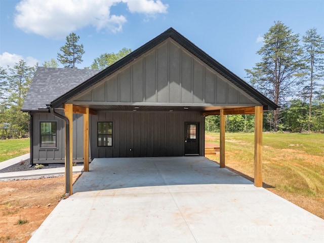 1872 Piney Mountain Church Rd, Bostic, NC 28018 - modern farmhouse with a front lawn, driveway, board and batten siding, a shingled roof, and an attached carport