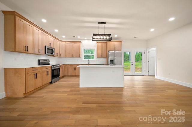 1872 Piney Mountain Church Rd, Bostic, NC 28018 - kitchen featuring appliances with stainless steel finishes, baseboards, light wood-style floors, and recessed lighting