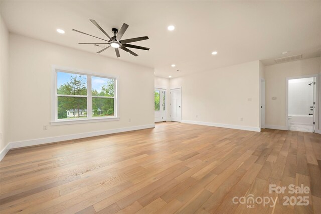 1872 Piney Mountain Church Rd, Bostic, NC 28018 - unfurnished living room with light wood-style floors, ceiling fan, baseboards, and recessed lighting