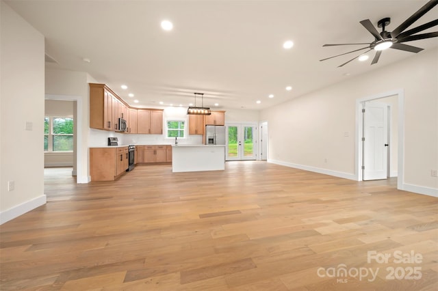1872 Piney Mountain Church Rd, Bostic, NC 28018 - unfurnished living room with recessed lighting, light wood-style flooring, ceiling fan, baseboards, and a sink