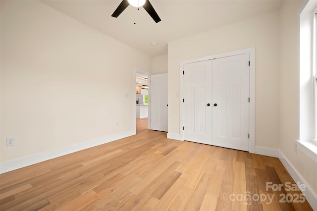 1872 Piney Mountain Church Rd, Bostic, NC 28018 - unfurnished bedroom featuring light wood-style flooring, baseboards, a closet, and ceiling fan