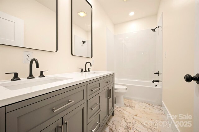 1872 Piney Mountain Church Rd, Bostic, NC 28018 - full bathroom featuring toilet, double vanity, marble finish floors, baseboards, and  shower combination