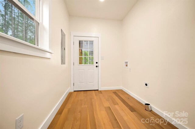 1872 Piney Mountain Church Rd, Bostic, NC 28018 - doorway to outside featuring baseboards, light wood finished floors, and electric panel