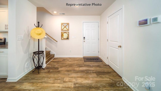 3748 13th St NE, Hickory, NC 28601 - foyer with wood finished floors, stairway, baseboards, and recessed lighting