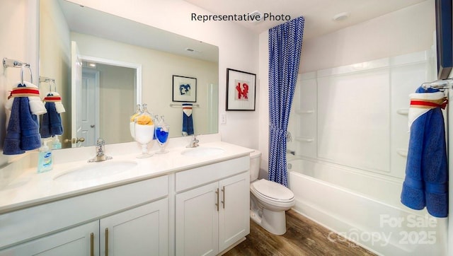 3748 13th St NE, Hickory, NC 28601 - full bathroom featuring toilet, wood finished floors, double vanity, and shower / tub combo with curtain