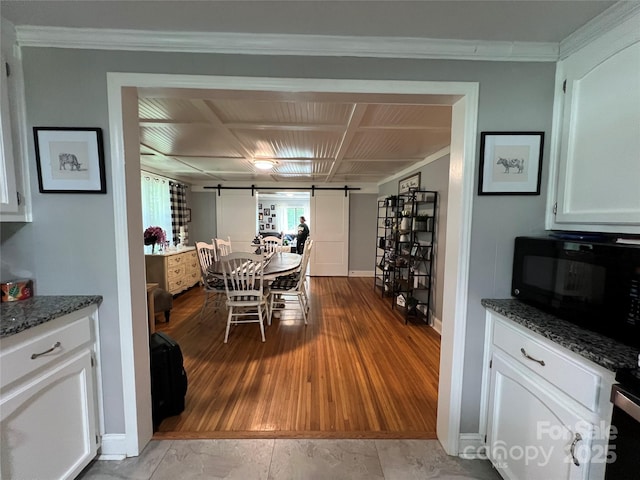 340 Cherry Mountain St, Forest City, NC 28043 - dining space with a barn door, baseboards, and crown molding