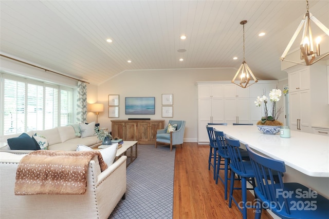 4126 Tyndale Ave, Charlotte, NC 28210 - living area featuring vaulted ceiling, wooden ceiling, light wood-style floors, recessed lighting, and a chandelier