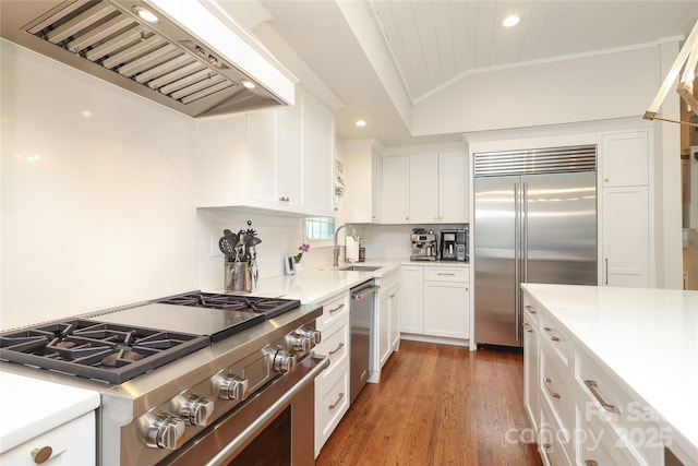 4126 Tyndale Ave, Charlotte, NC 28210 - kitchen with high quality appliances, wall chimney range hood, lofted ceiling, recessed lighting, and light wood-type flooring