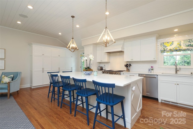 4126 Tyndale Ave, Charlotte, NC 28210 - kitchen with stainless steel dishwasher, custom exhaust hood, white cabinetry, a kitchen island, and recessed lighting