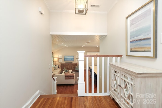 4126 Tyndale Ave, Charlotte, NC 28210 - hall with wood finished floors, an upstairs landing, crown molding, and recessed lighting
