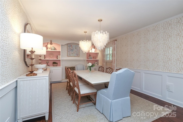 4126 Tyndale Ave, Charlotte, NC 28210 - dining area featuring wallpapered walls, a wainscoted wall, crown molding, a chandelier, and wood finished floors