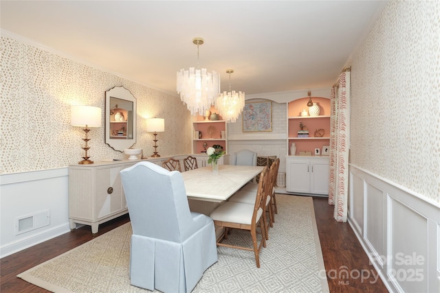 4126 Tyndale Ave, Charlotte, NC 28210 - dining space with wallpapered walls, wainscoting, a chandelier, dark wood-style floors, and crown molding