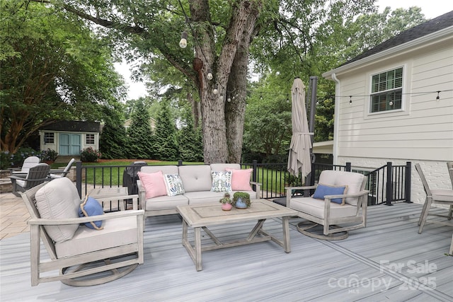 4126 Tyndale Ave, Charlotte, NC 28210 - wooden terrace with outdoor lounge area and a storage unit