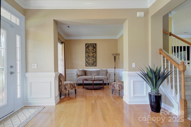 604 Palmerston Ln, Waxhaw, NC 28173 - foyer featuring light wood-style floors, plenty of natural light, stairs, crown molding, and wainscoting