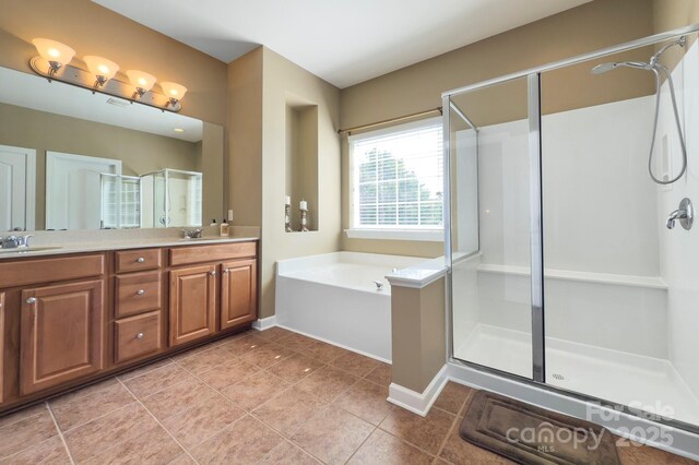 604 Palmerston Ln, Waxhaw, NC 28173 - full bathroom with a shower stall, double vanity, tile patterned flooring, and a bath