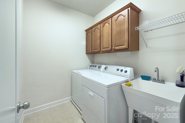 604 Palmerston Ln, Waxhaw, NC 28173 - laundry room with independent washer and dryer, cabinet space, and light flooring