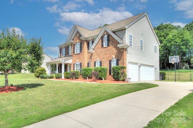 604 Palmerston Ln, Waxhaw, NC 28173 - colonial house featuring concrete driveway, an attached garage, brick siding, and roof with shingles