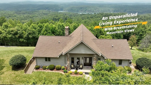 4933 NC Highway 268 W, Wilkesboro, NC 28697 - view of front of property with a wooded view, a chimney, a front yard, and roof with shingles