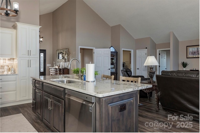 4933 NC Highway 268 W, Wilkesboro, NC 28697 - kitchen with dishwasher, a sink, high vaulted ceiling, dark wood-style floors, and white cabinetry