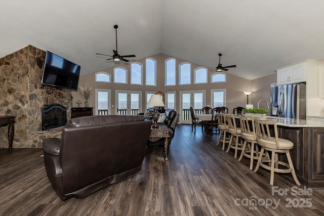 4933 NC Highway 268 W, Wilkesboro, NC 28697 - living area featuring a ceiling fan, a fireplace, dark wood-style floors, and high vaulted ceiling