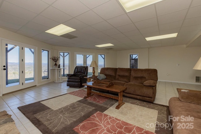 4933 NC Highway 268 W, Wilkesboro, NC 28697 - living room with tile patterned flooring, a drop ceiling, and baseboards