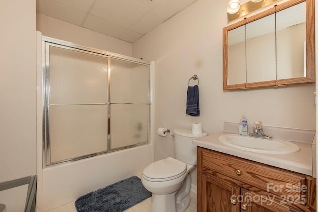 4933 NC Highway 268 W, Wilkesboro, NC 28697 - bathroom featuring vanity, toilet, enclosed tub / shower combo, a paneled ceiling, and tile patterned flooring