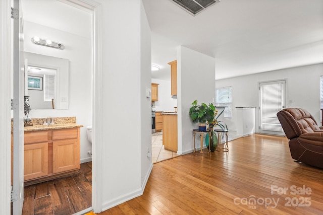 9236 Clifton Meadow Dr, Matthews, NC 28105 - corridor featuring hardwood / wood-style flooring and baseboards