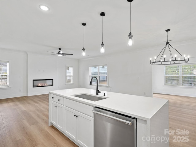 8303 Adrian Ct, Charlotte, NC 28270 - kitchen featuring stainless steel dishwasher, a sink, open floor plan, ornamental molding, and light wood-style floors