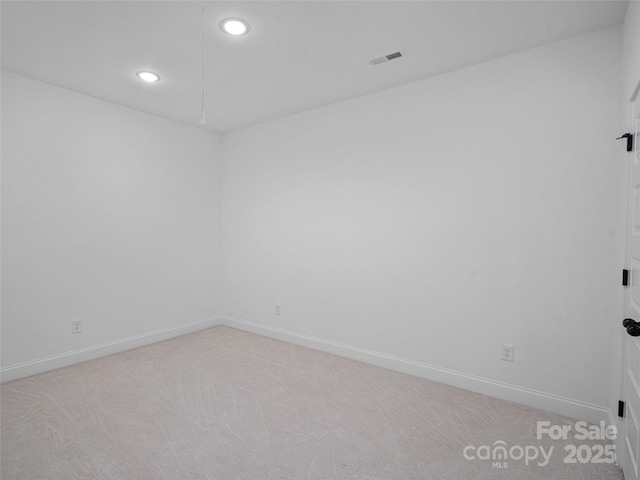 8303 Adrian Ct, Charlotte, NC 28270 - spare room with light colored carpet, baseboards, and recessed lighting