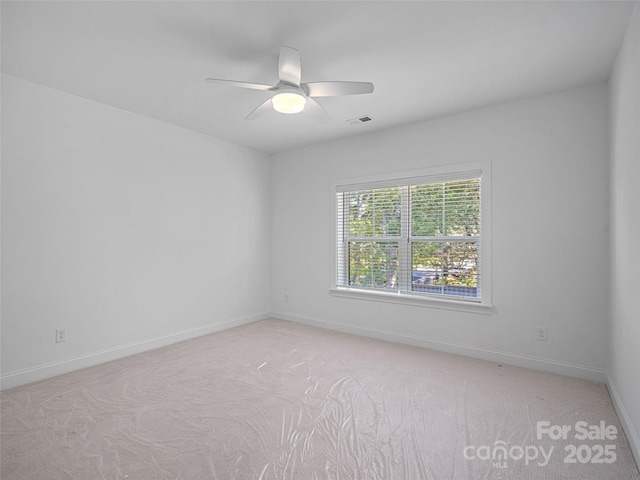 8303 Adrian Ct, Charlotte, NC 28270 - spare room with light carpet, baseboards, and ceiling fan