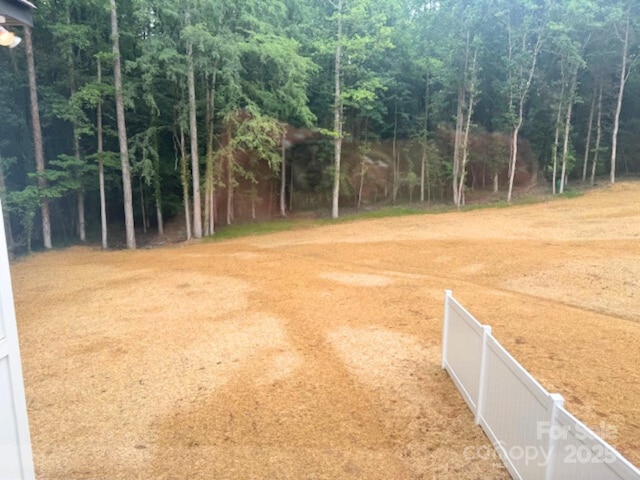 8303 Adrian Ct, Charlotte, NC 28270 - view of yard with a forest view