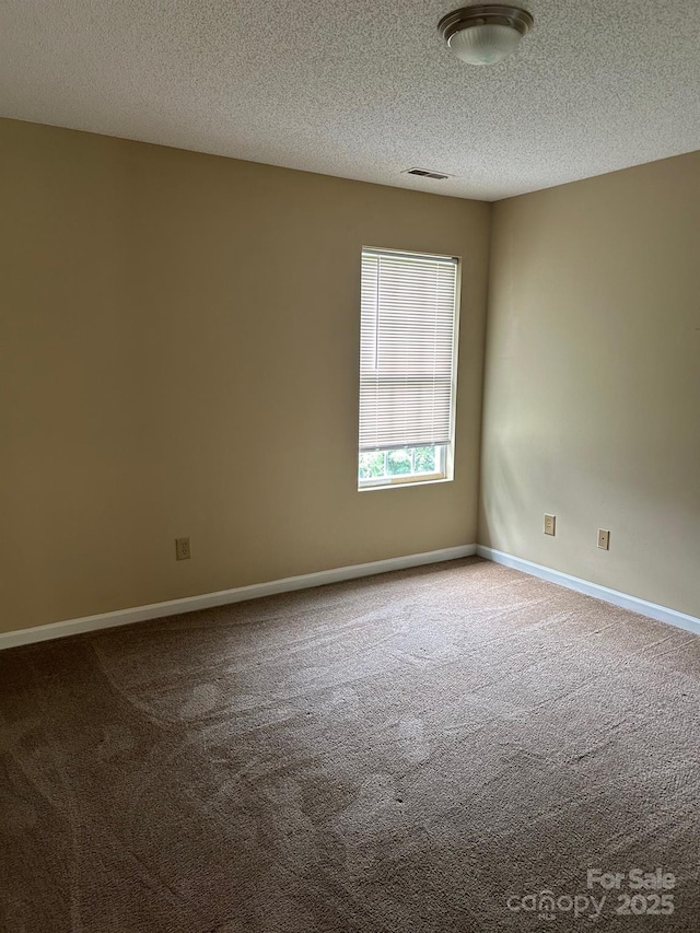 8125 Weeping Fig Ln, Charlotte, NC 28215 - empty room with carpet and a textured ceiling