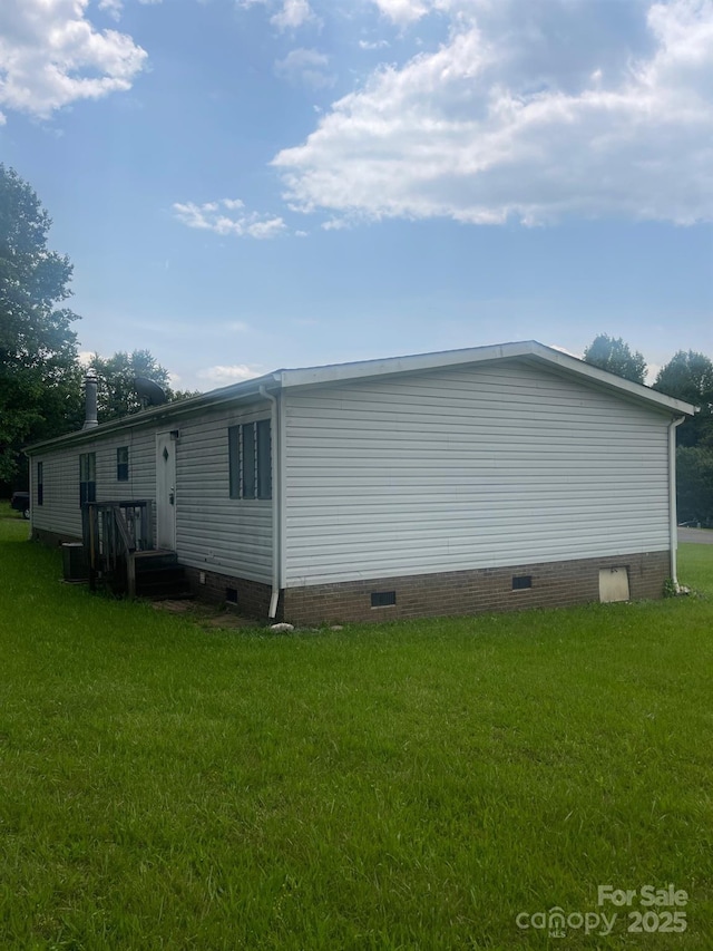 5587 Doe Ct, Morganton, NC 28655 - view of side of home featuring crawl space, a yard, and cooling unit