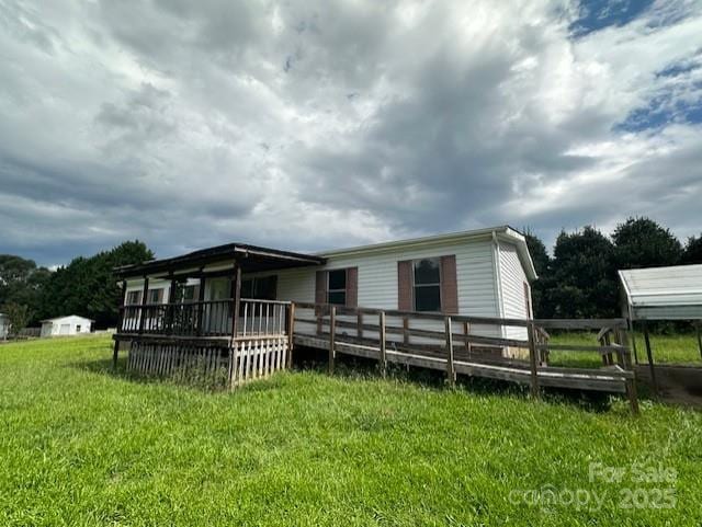 5587 Doe Ct, Morganton, NC 28655 - back of property featuring a deck and a lawn