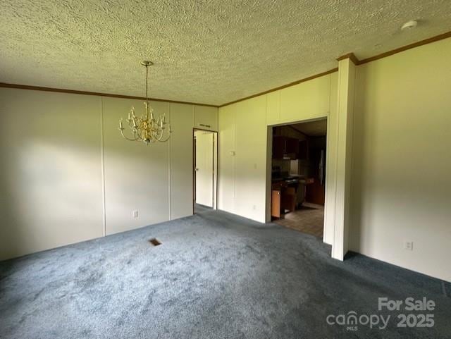 5587 Doe Ct, Morganton, NC 28655 - unfurnished dining area with crown molding, a chandelier, carpet, and a textured ceiling