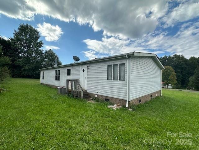 5587 Doe Ct, Morganton, NC 28655 - rear view of house featuring crawl space, a yard, and central air condition unit