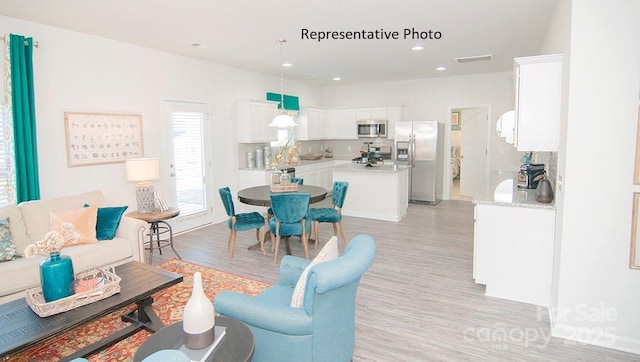 145 Apple Orchard Ct, Statesville, NC 28677 - living area with light wood-style flooring and recessed lighting