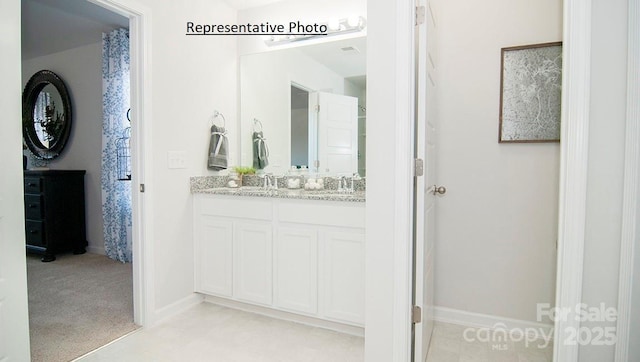 145 Apple Orchard Ct, Statesville, NC 28677 - bathroom with double vanity and baseboards