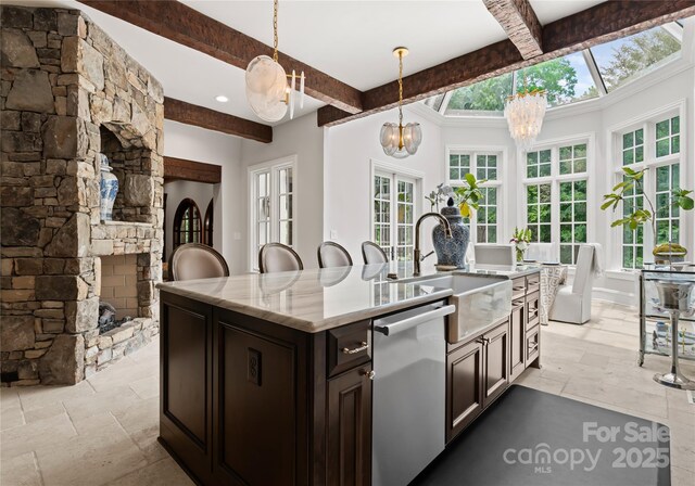 8500 Longview Club Dr, Waxhaw, NC 28173 - kitchen featuring dishwasher, beam ceiling, a chandelier, stone tile floors, and plenty of natural light