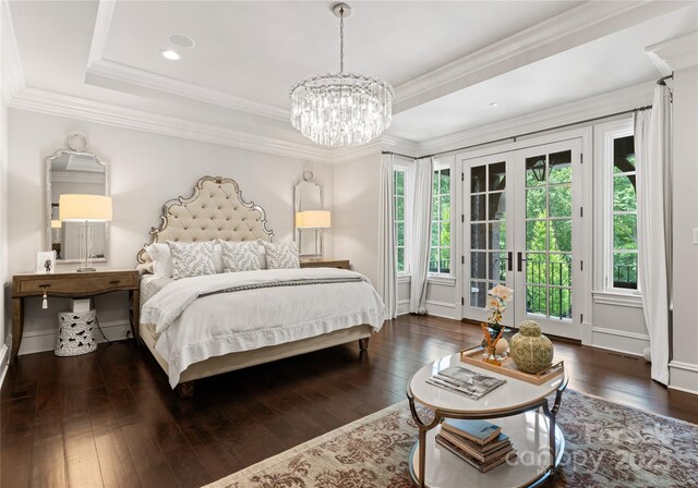 8500 Longview Club Dr, Waxhaw, NC 28173 - bedroom with access to exterior, hardwood / wood-style floors, a chandelier, and a raised ceiling