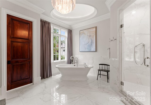 8500 Longview Club Dr, Waxhaw, NC 28173 - full bathroom with a marble finish shower, a freestanding bath, marble tiled floors, crown molding, and tile walls
