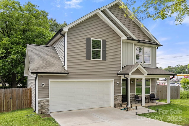 4209 Grier St, Gastonia, NC 28056 - craftsman-style house featuring stone siding, a garage, driveway, board and batten siding, and a shingled roof