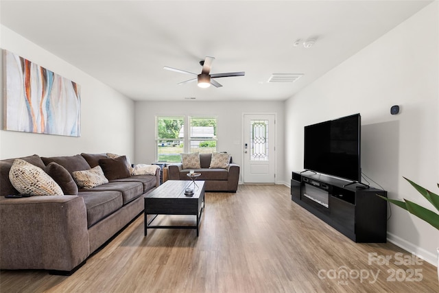 4209 Grier St, Gastonia, NC 28056 - living room featuring light wood-style flooring, ceiling fan, and baseboards