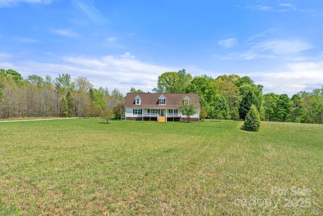 1285 Waitman Rd, Lexington, NC 27295 - view of grassy yard with a forest view and a porch