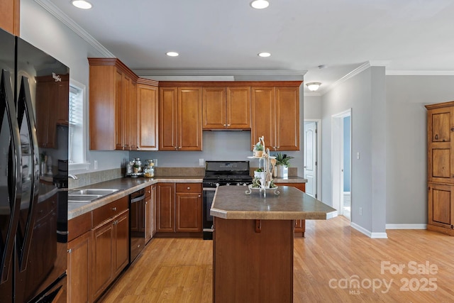 1285 Waitman Rd, Lexington, NC 27295 - kitchen featuring range with gas stovetop, black fridge, dishwasher, a sink, and light wood-style floors