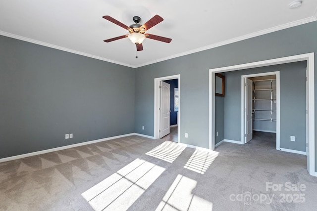 1285 Waitman Rd, Lexington, NC 27295 - unfurnished bedroom with carpet floors, crown molding, a walk in closet, and baseboards